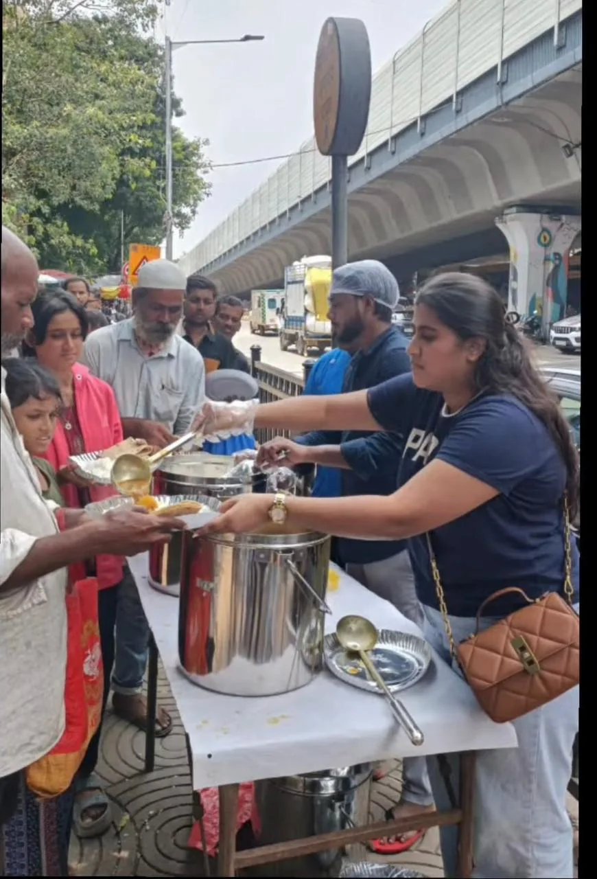 Volunteer serving a hot meal