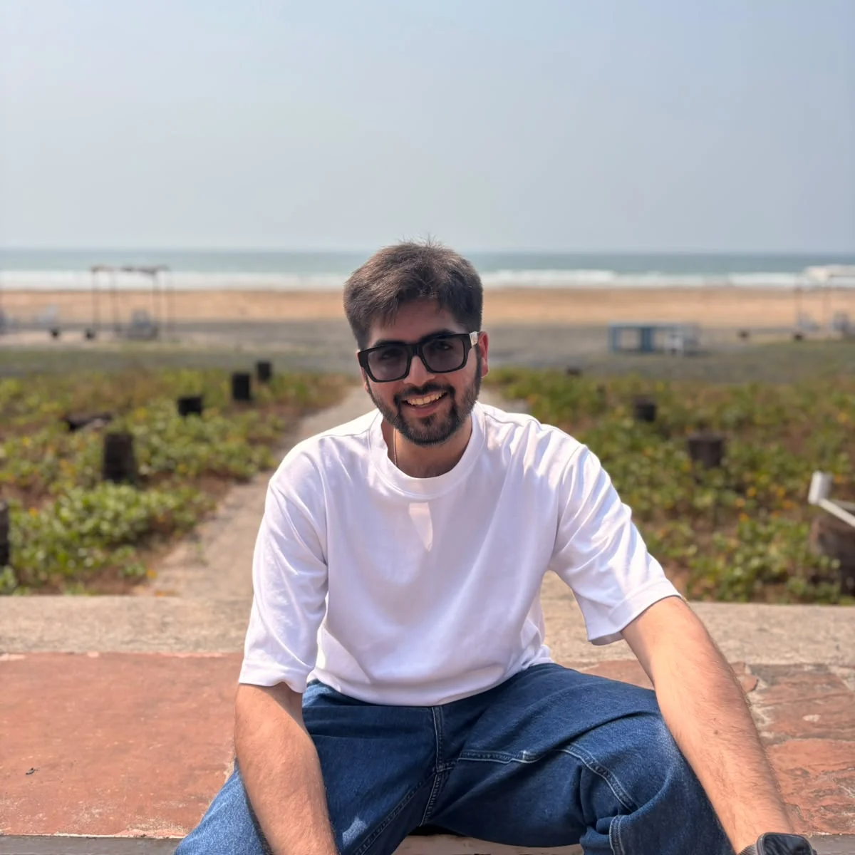 Portrait of Mohit M. Jainani seated near Mumbai's shoreline